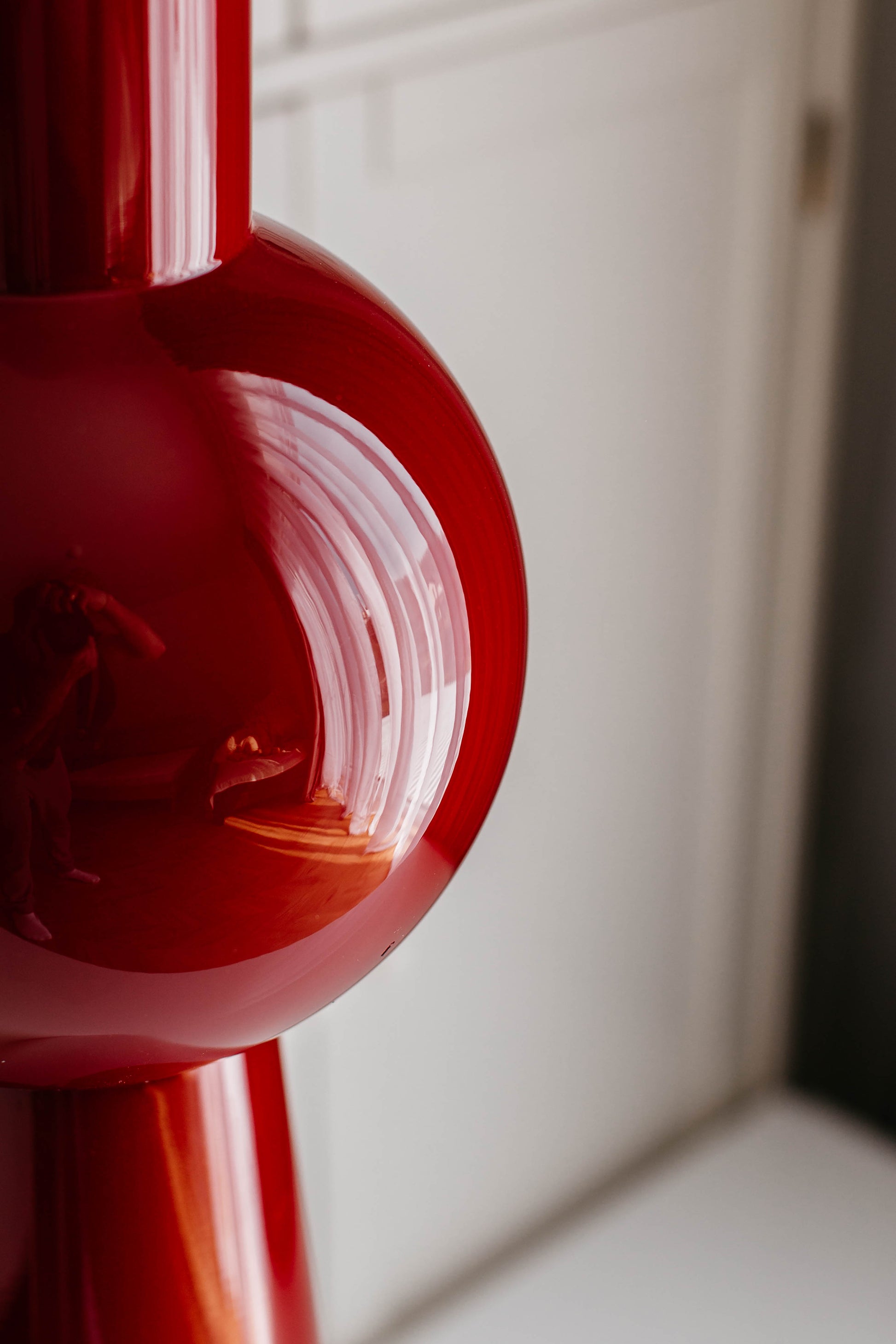 Close-up of a red vase with a white background