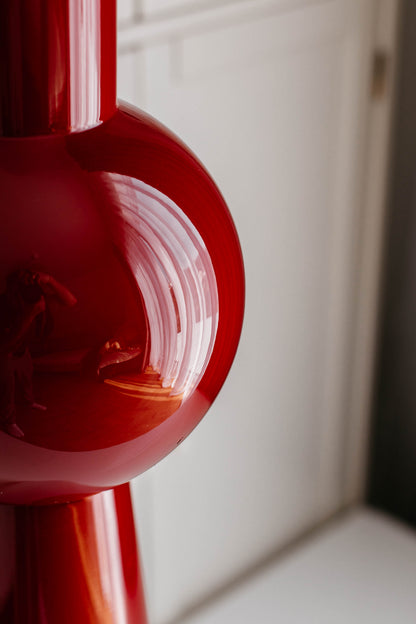 Close-up of a red vase with a white background